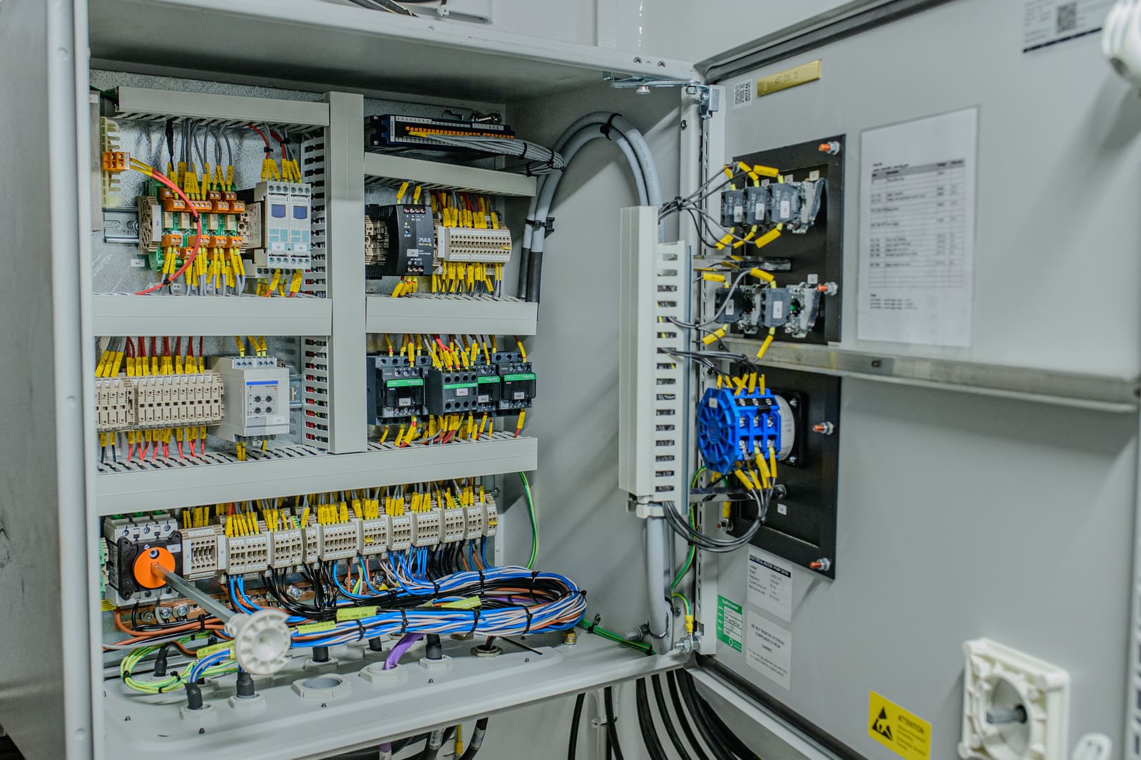 Open marine control cabinet with Siemens automation hardware, terminal blocks, and signal cables fully terminated and labelled