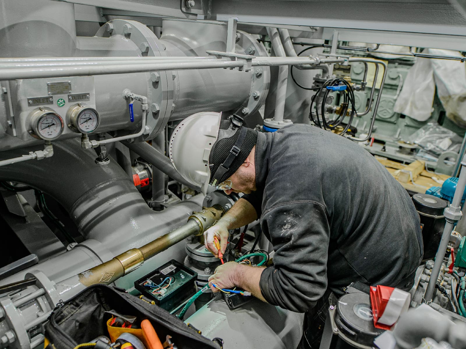 Black Frog Elektro technician performing lifecycle maintenance and electrical refit work on a vessel.